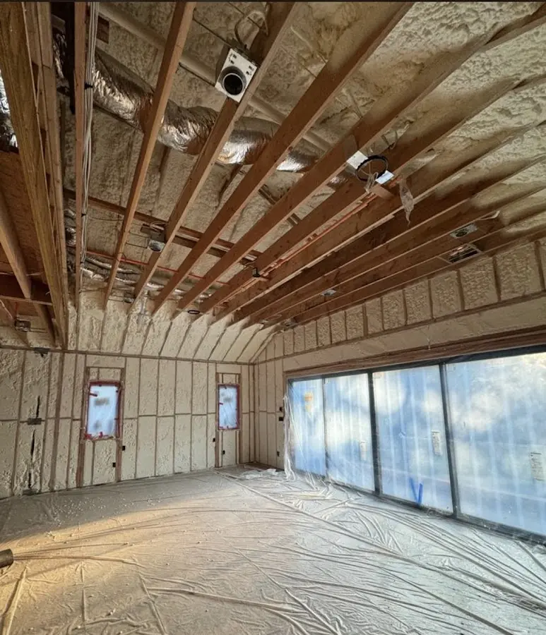 Interior walls and ceiling insulated with spray foam during new construction in Kendall